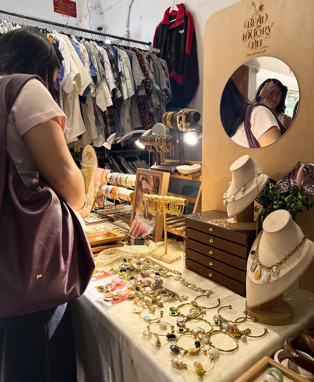 Bead Factory PH booth at pop-up market with customer browsing jewelry
